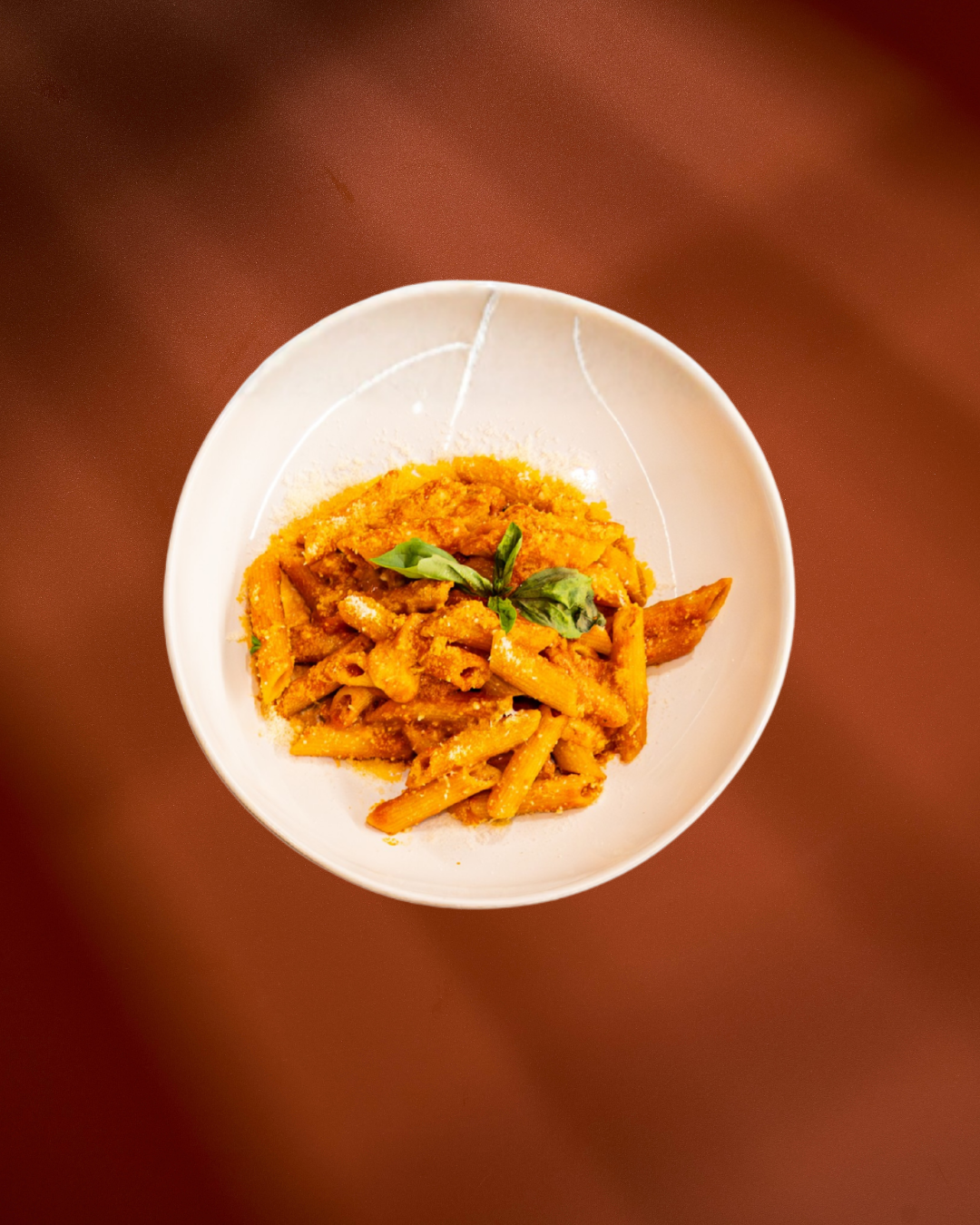 Penne Sorrentina de Pietta con tomate, scamorza, parmesano y albahaca fresca, a domicilio en Granada